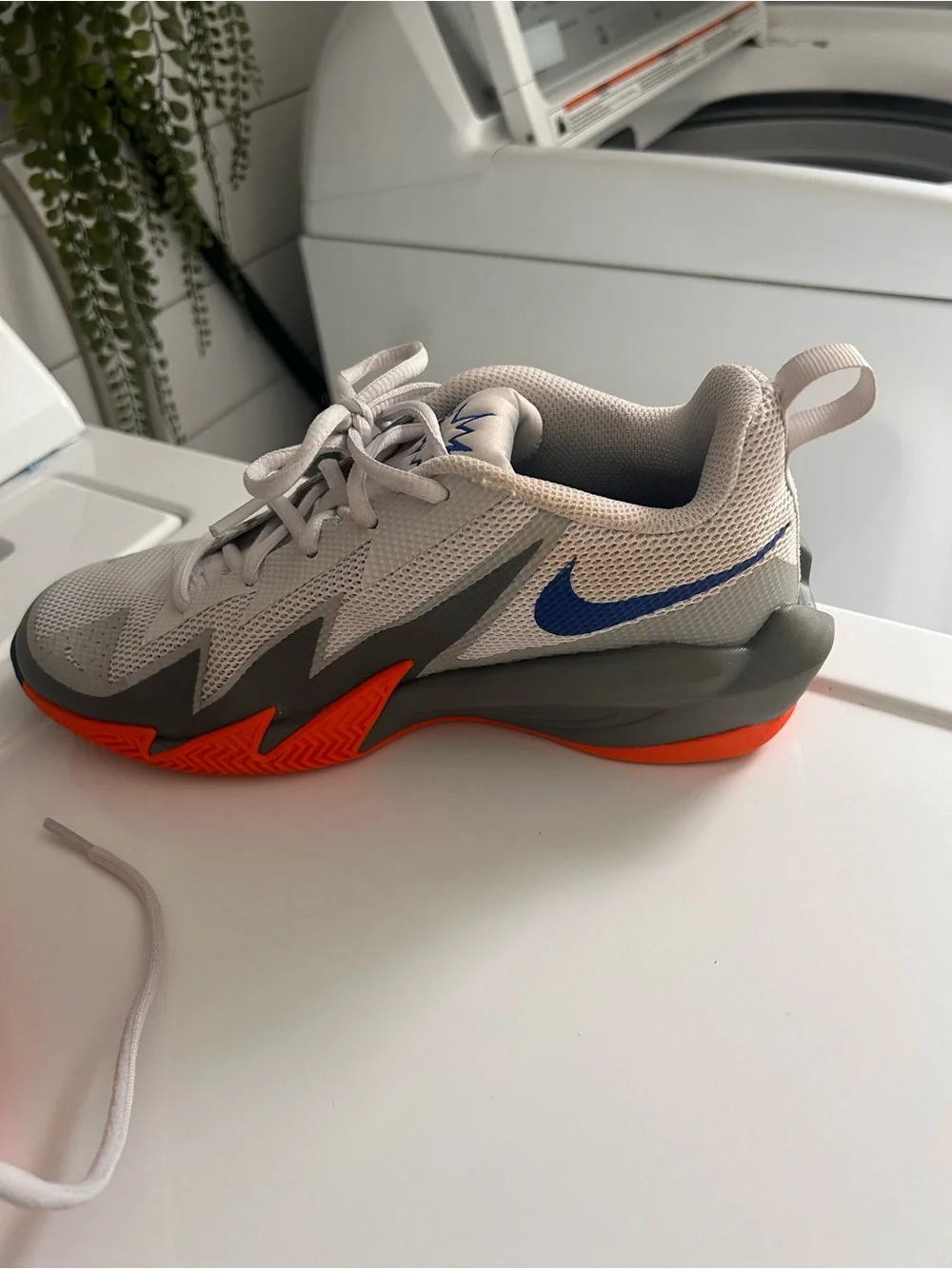 Nike Men's Light Gray Mesh Sneakers with Orange Swoosh and Blue Accents